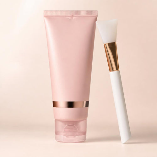 Dewlyn Collagen Night Wrapping Mask tube with silicone applicator brush on a cream studio backdrop